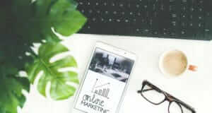 Outbound Marketing vs. Inbound Marketing glasses, iPad and coffee