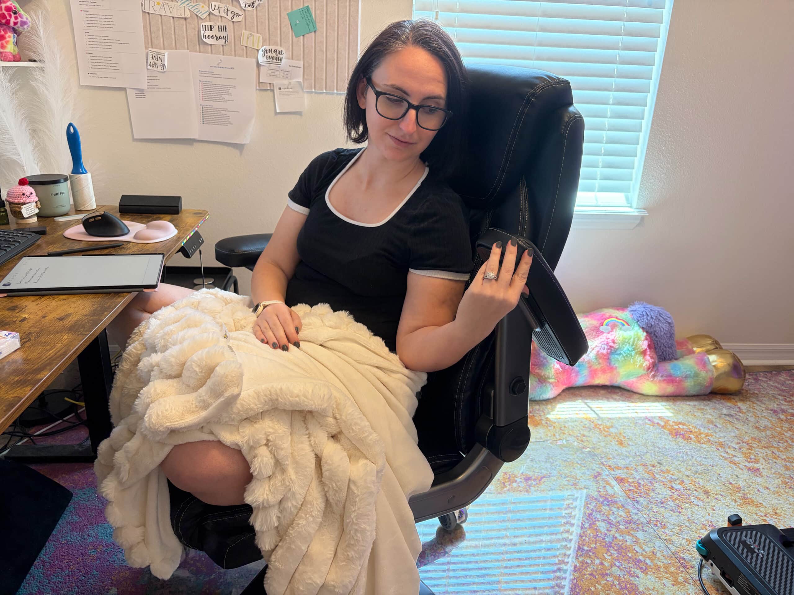 Adjusting the five-way armrest on a high-back executive office chair